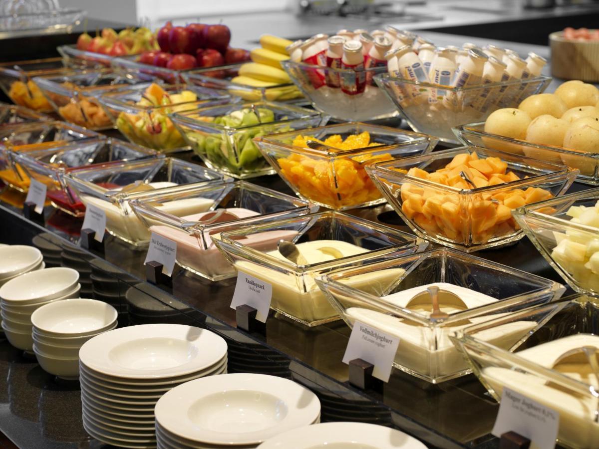 Conrad Hamburg Hotel Exterior photo A buffet of fruit and cheese